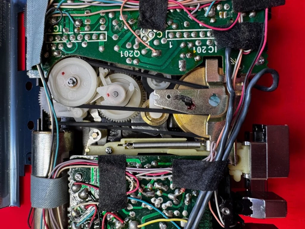 Close-up of the TPS-L2 mechanism with its belts, flywheel and motor